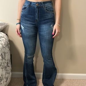 high rise, dark blue, wide lag jeans.